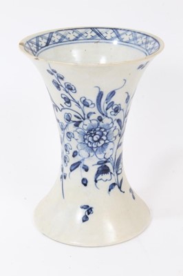 Lot 144 - English pearlware vase, late 18th century, of waisted form, decorated in underglaze blue with flowers, and a diaper pattern on the inside rim, 13.5cm high