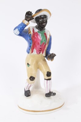 Lot 166 - A Staffordshire porcelain figure of a black child, circa 1840