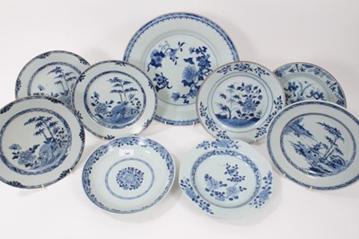 Lot 145 - Nine Chinese blue and white export dishes, 18th century, the largest measuring 31.5cm diameter, the rest approx 22.5cm