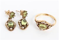 Lot 3329 - Gold (9ct) peridot and seed pearl ring with a...