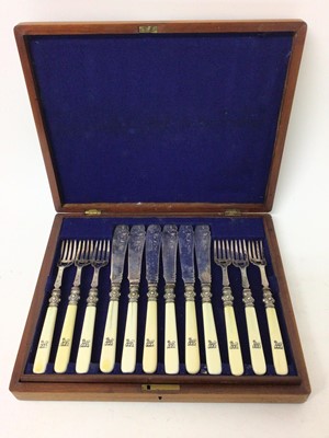 Lot 411 - Victorian canteen of twelve pairs of silver plated fish eaters with engraved decoration and turned ivory handles with engraved armorials in blue baize lined mahogany canteen