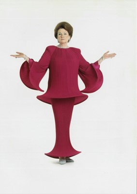 Lot 2118 - Designer Yuki (Gnyuki Torimaru) Sculptural polyester pleated three with hooped sleeves and hem.  Sold with a Patrick Lichfield photograph of the late Lady Elizabeth Shakerley wearing this dress.