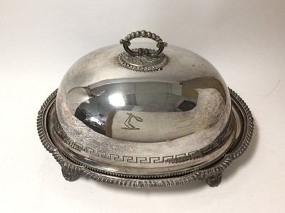 Lot 420 - 19th century silver plated meat cover / serving dome with engraved band of Greek key decoration and engraved armorial, beaded border and beaded scroll handle together with an associated stand with