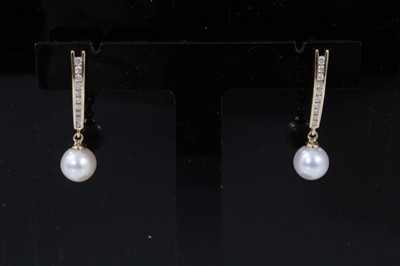 Lot 299 - Pair 14ct gold cultured pearl and diamond pendant earring