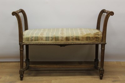 Lot 1329 - 19th century Continental beech window seat, with carved scroll ends and stuffover seat on fluted legs and H-shaped stretcher