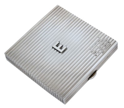 Lot 61 - Lady Elizabeth Shakerley C.V.O. (1941-2020), Cartier silver powder compact of square ribbed form with central E monogram ( HM Birmingham 1972) 7cm x 7cm x 1cm, in original Cartier fitted red leath...