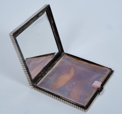 Lot 61 - Lady Elizabeth Shakerley C.V.O. (1941-2020), Cartier silver powder compact of square ribbed form with central E monogram ( HM Birmingham 1972) 7cm x 7cm x 1cm, in original Cartier fitted red leath...