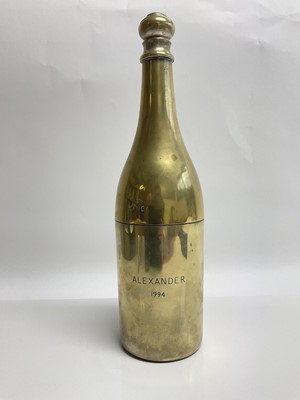Lot 87 - Dale,Baroness Tyron 'Kanga', Australian socialite and friend of The Prince of Wales, silver plated (worn) Champagne bottle flask engraved ' From Kanga Alexander 1994' . A gift from the Baroness to...