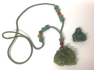 Lot 96 - Chinese carved green hardstone figure of a horse, 4.5cm wide, on a woven necklace with polished beads, together with a carved hardstone Buddha (2)