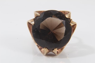 Lot 336 - 9ct gold smoky quartz cocktail ring in stylised gold setting