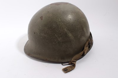Lot 921 - Second World War American rear seem steel paratrooper helmet 1944/1945 heat stamp H96A with liner by Westinghouse. Liner named to Corporal Calvin C. Cooper RA14296006. Complete with liner canvas ch...