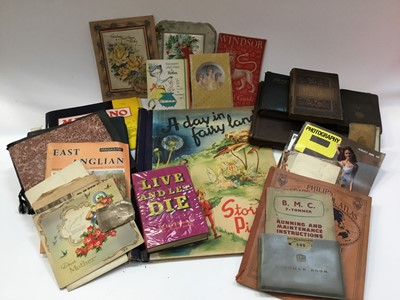 Lot 1448 - One box of mixed ephemera to include albums of photographs of auction posters, James Bond book and other items