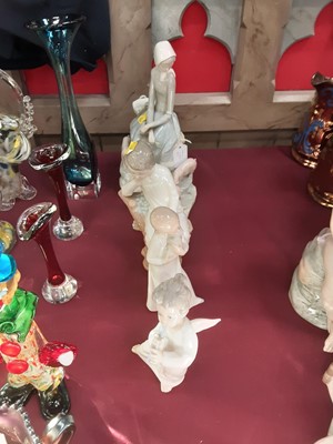 Lot 1187 - Collection of six Lladro and Nao figures, the largest measuring 29.5cm high