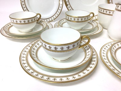Lot 68 - Adderleys Ltd. porcelain teaset, Rouen pattern eleven place setting with two cake plates, milk jug and sugar bowl, each decorated with borders of fleur-de-lis (37 pieces)