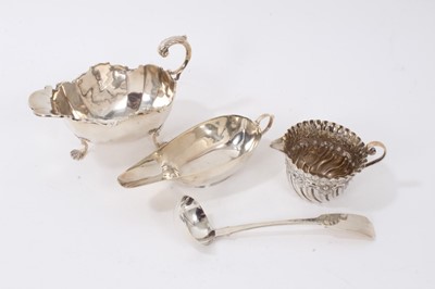 Lot 149 - Late Victorian silver sauce boat, Chester 1899, together with another silver sauce boat, Birmingham 1922, a silver cream jug, Sheffield 1899, and a silver sauce ladle, Glasgow 1837