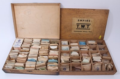 Lot 187 - Four wooden boxes of vintage new old stock watch glasses, various sizes and accessories