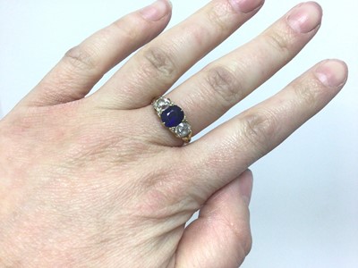 Lot 595 - Late Victorian diamond and sapphire three stone ring