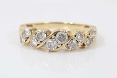 Lot 247 - 18ct gold diamond ten stone half eternity ring