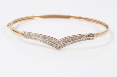 Lot 257 - 9ct gold diamond set bangle