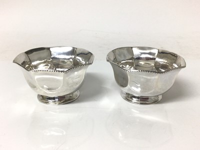 Lot 122 - Pair of white metal footed bowls, of octagonal form, with beaded borders, both marked on the bases with two flowers within a scallop shell, 7.75cm across x 4.25cm high