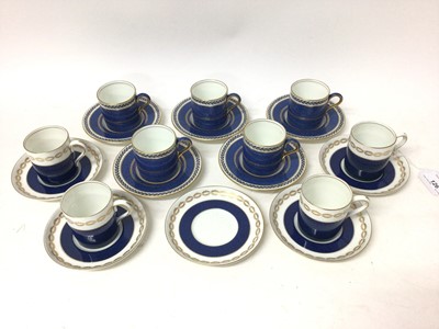 Lot 126 - Wedgwood five-person coffee set, decorated with gilt foliate patterns on a powder blue ground, together with a similar four-person Bisto coffee set, with one extra saucer