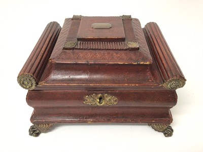 Lot 211 - Fine Regency red leather jewel/ needlework casket of sarcofogus form with gilt metal mounts , concealed correspondence compartment in lid, raised on gilt metal claw feet 27.5 cm wide, 21 cm deep, 1...