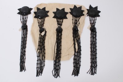 Lot 2160 - Group of Five 1920's  Large Dress Couture Ornamentations. Unused, two still attached to original cloth and the other three are loose, one has lost two small pieces.  Black glass beading in Geometri...