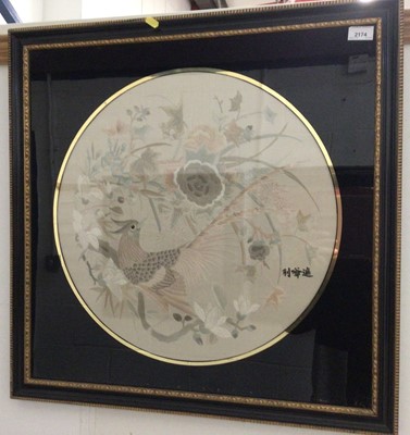 Lot 2174 - Pair of 1920s / 30s Japanese embroidered silk circular panels in verre églomisé frames