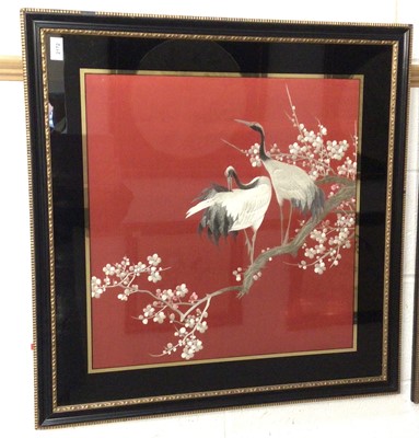 Lot 2172 - 1920s / 30sJapanese embroidered silk panel on red ground in verre églomisé frame