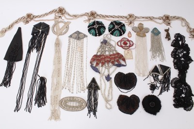 Lot 2163 - A selection of Victorian and later dress embellishes, appliques, beading etc.  including Art Deco beaded belt, bead and tassel shoulder embellishment, pair of cord and rhinestone domed decoration.