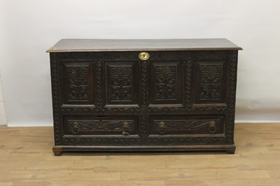 Lot 1515 - 18th century carved oak mule chest
