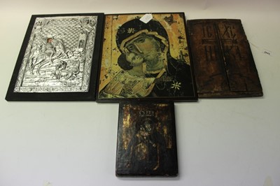 Lot 2643 - Group of religious icons to include an image of the Madonna and child in a hinged frame and a white metal mounted icon (possibly Greek) (4)