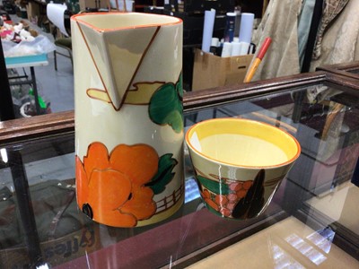 Lot 1264 - Clarice Cliff Bizarre range Fantasque milk Jug and cup (2)