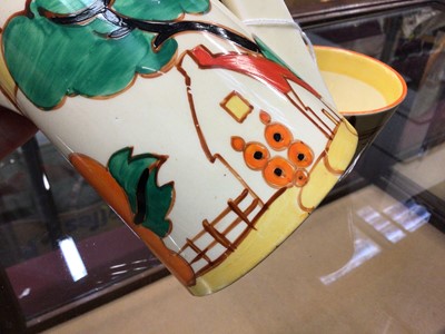 Lot 1264 - Clarice Cliff Bizarre range Fantasque milk Jug and cup (2)