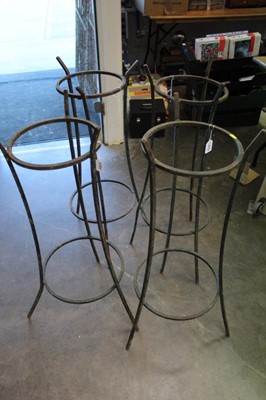 Lot 2662 - Four iron garden stands