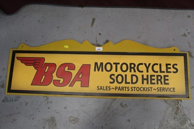 Lot 2047 - Wooden plaque with applied reproduction vinyl sign 'BSA Motorcycles Sold Here', 102cm in length
