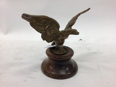 Lot 2013 - Brass car mascot in the form of an Eagle, mounted on a wooden base, possibly for an Alvis, 15.5cm in height including base