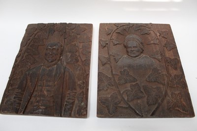 Lot 2525 - Pair of continental carved oak plaques, with portraits of a man and woman in relief, 35.5cm high