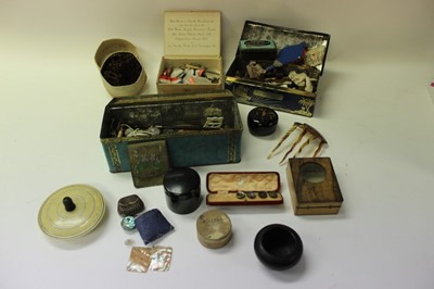Lot 2560 - Two vintage tins containing various buttons, other sewing items and sundries