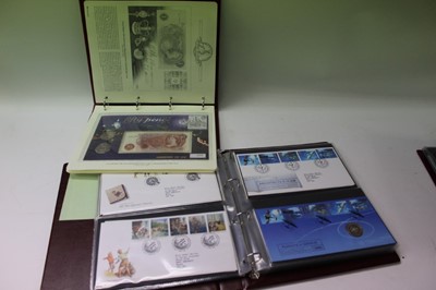 Lot 1365 - World mixed stamp, coin and banknote covers to include the Royal Mail First Day Covers and World Warr II etc, in four presentation albums (qty)