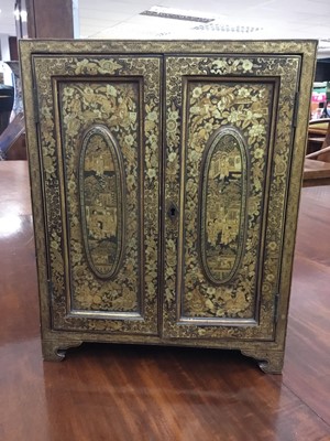 Lot 2556 - 19th century Chinese lacquer table cabinet with gilt decoraton and pair of hinged doors opening to reveal five draws to interior