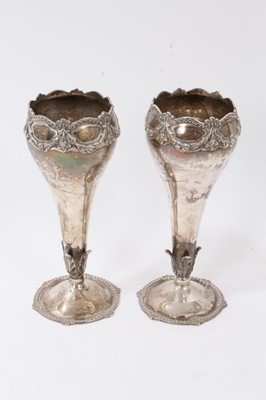 Lot 388 - Pair silver vases of tapering form with floral swag decoration