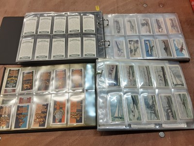 Lot 1611 - Cigarette cards aviation collection housed in four albums including Mars Confectionary, Ardath speed, land, sea and air B.A.T. aeroplanes of today, Wills aviation plus others (qty)