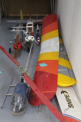 Lot 2650 - Two remote control model planes (lacking controllers) together with a similar helicopter and a glider (4 models)