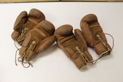Lot 2675 - Two pairs of vintage brown leather boxing gloves