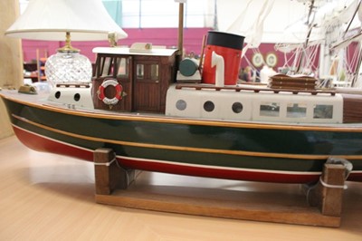 Lot 2669 - Good quality large scratch built radio controlled model of a ship 'H.M. Customs Badger', (remote lacking), together with stand, approximately 121cm in length
