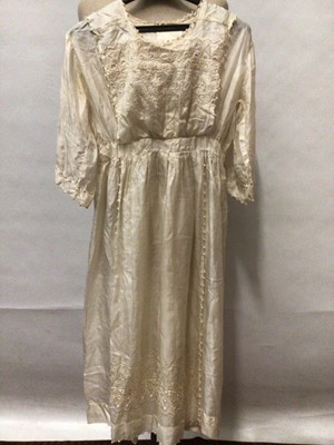 Lot 2180 - c1910 Girl’s embroidered silk dress with pearl  beading. An Edwardian cotton and lace petticoat, cotton and lace nighty, similar mop cap plus a babies dress and nighty.