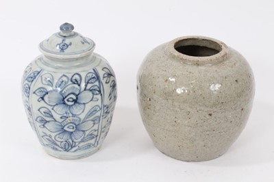Lot 167 - 17th / 18th century Chinese blue and white jar and cover with floral decoration and another later 19th century Chinese provincial jar (2)